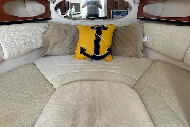 Slide: The Image of Interior cabin of 2004 Sea Ray 260 Sundancer with anchor-themed pillow. - 10