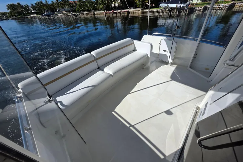 Slide: The Image of 2005 Carver 41 Cockpit Motor Yacht with spacious seating and scenic water view. - 19