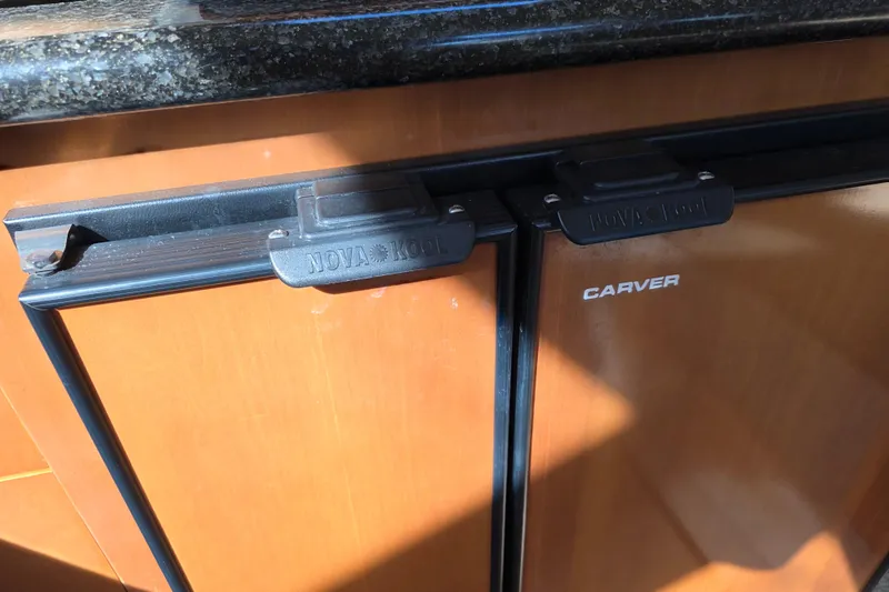 Slide: The Image of Fridge on 2005 Carver 41 Cockpit Motor Yacht with Nova Kool latches. - 34