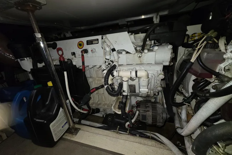 Slide: The Image of Engine room of a 2005 Carver 41 Cockpit Motor Yacht, featuring Volvo Penta components. - 35