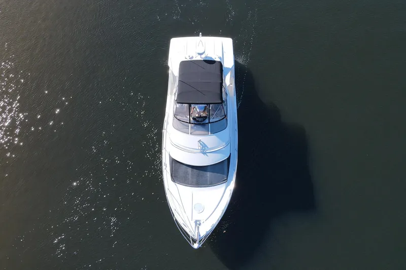 Slide: The Image of Aerial view of 2005 Carver 41 Cockpit Motor Yacht on calm water. - 6