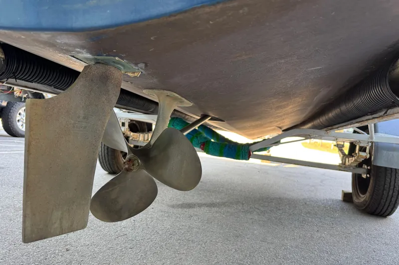 Slide: The Image of Underneath view of a 1975 Century Raven boat showing propeller and rudder. - 10