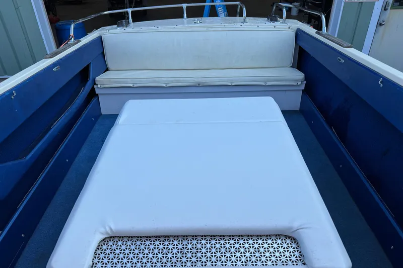 Slide: The Image of 1975 Century Raven boat interior with blue and white seating. - 3