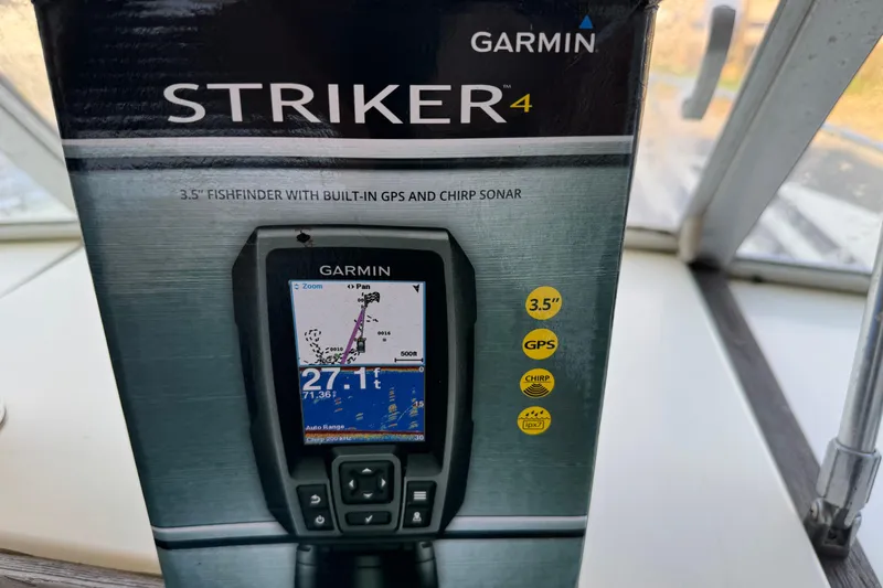 Slide: The Image of Garmin Striker 4 fishfinder box with GPS and CHIRP sonar features. - 9