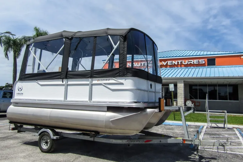 The Image of 2025 Armada v17 pontoon boat on trailer outside Nautical Ventures store. - 0