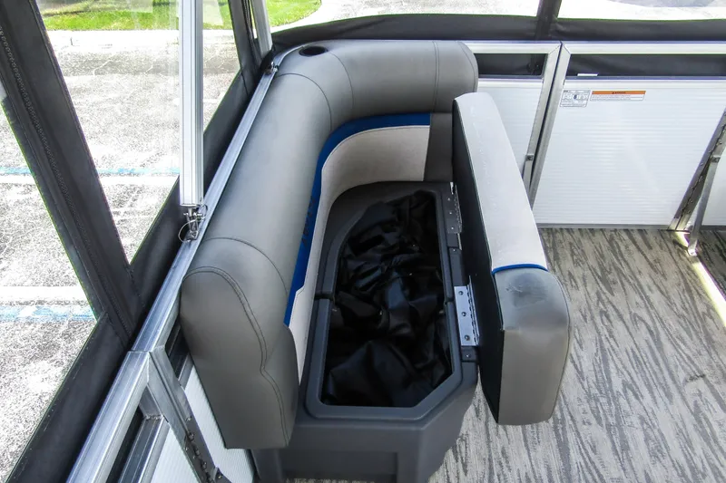 Slide: The Image of Armada v17 2025 boat interior with gray seating and storage compartment. - 12