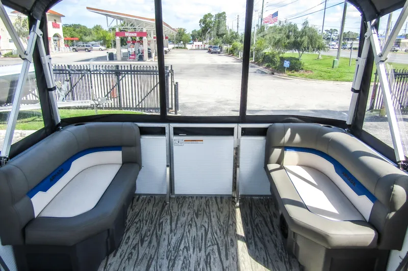 Slide: The Image of Interior of 2025 Armada v17 boat with cushioned seating and wood-patterned flooring. - 13