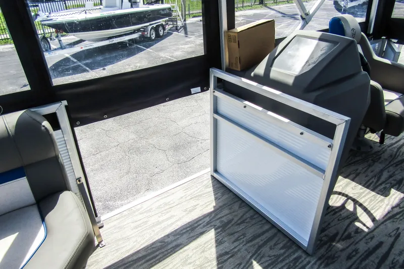 Slide: The Image of Interior of 2025 Armada v17 boat with seating and equipment, parked outside. - 16