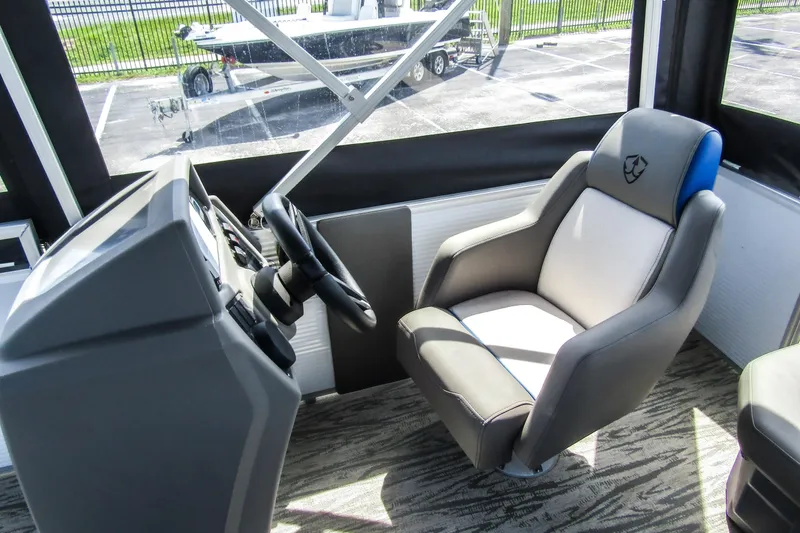 Slide: The Image of Captain's chair and helm of 2025 Armada v17 boat, featuring modern design and controls. - 17
