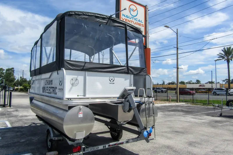 Slide: The Image of 2025 Armada v17 electric pontoon boat at Nautical Ventures dealership. - 4