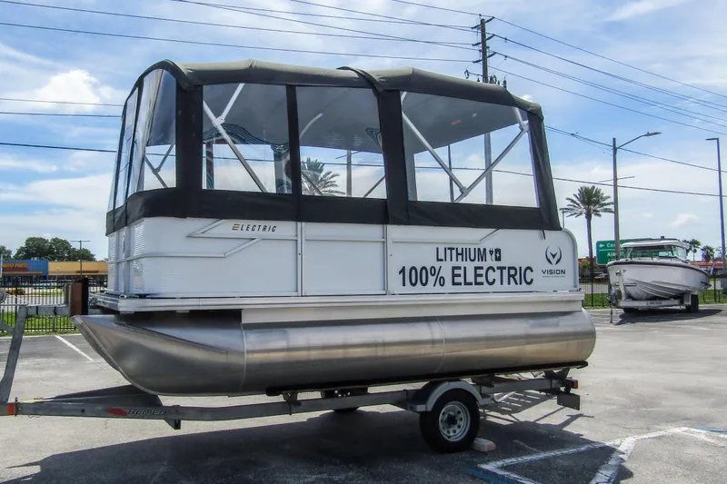 Slide: The Image of 2025 Armada v17 electric pontoon boat with lithium battery on trailer. - 7