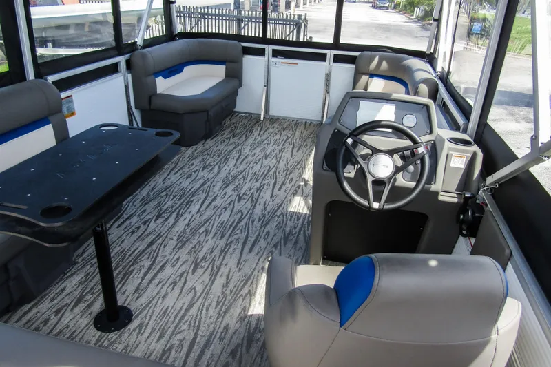 Slide: The Image of Interior of 2025 Armada v17 boat with modern seating and steering console. - 9