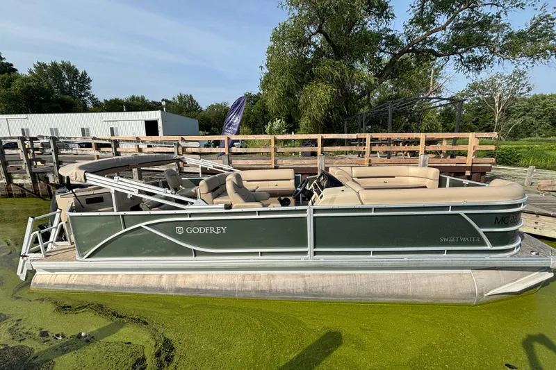 The Image of 2024 Godfrey SW2286FS pontoon boat docked on a sunny day. - 0