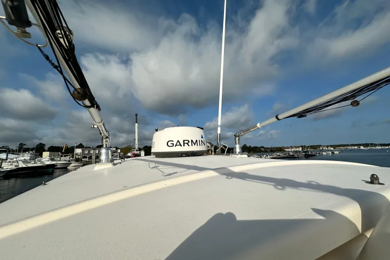 Slide: The Image of 2019 Grady-White Fisherman 257 boat with Garmin equipment, docked under a cloudy sky. - 10