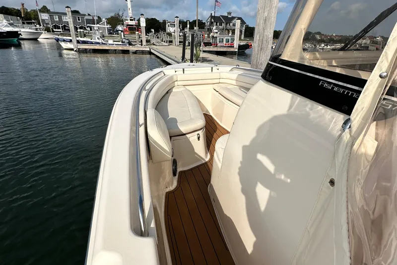 Slide: The Image of 2019 Grady-White Fisherman 257 boat docked at marina, featuring spacious seating area. - 11
