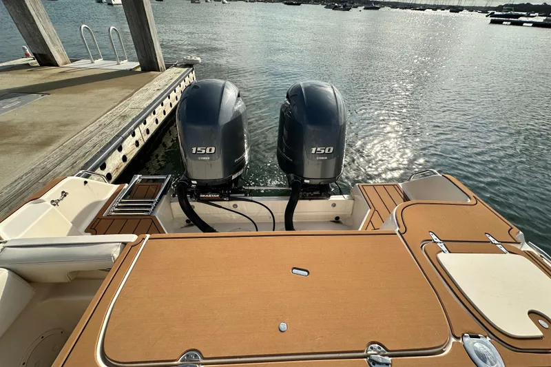 Slide: The Image of 2019 Grady-White Fisherman 257 boat with twin Yamaha 150 engines at dock. - 14