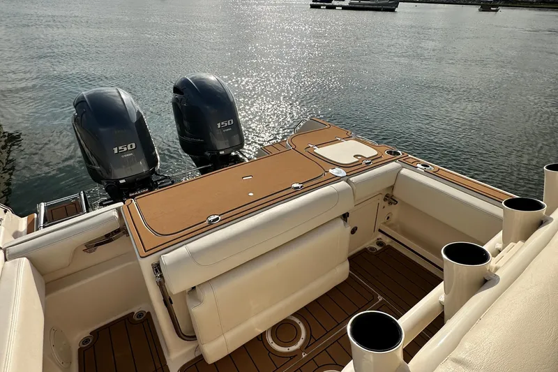 Slide: The Image of 2019 Grady-White Fisherman 257 boat with twin Yamaha 150 engines on calm water. - 15