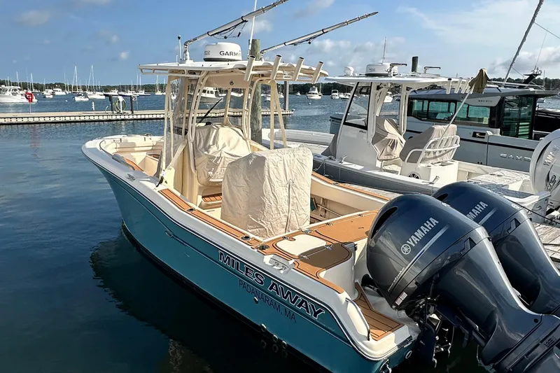Slide: The Image of 2019 Grady-White Fisherman 257 boat docked with Yamaha engines, clear sky background. - 21