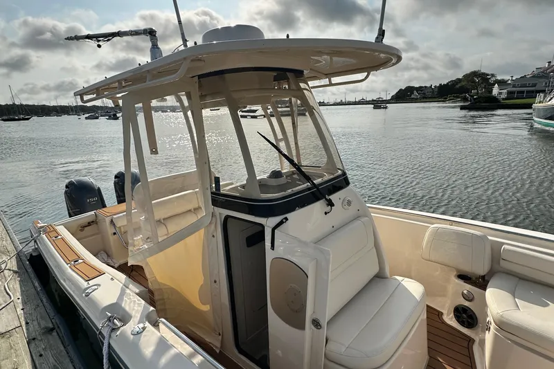 Slide: The Image of 2019 Grady-White Fisherman 257 boat docked by the water on a sunny day. - 4