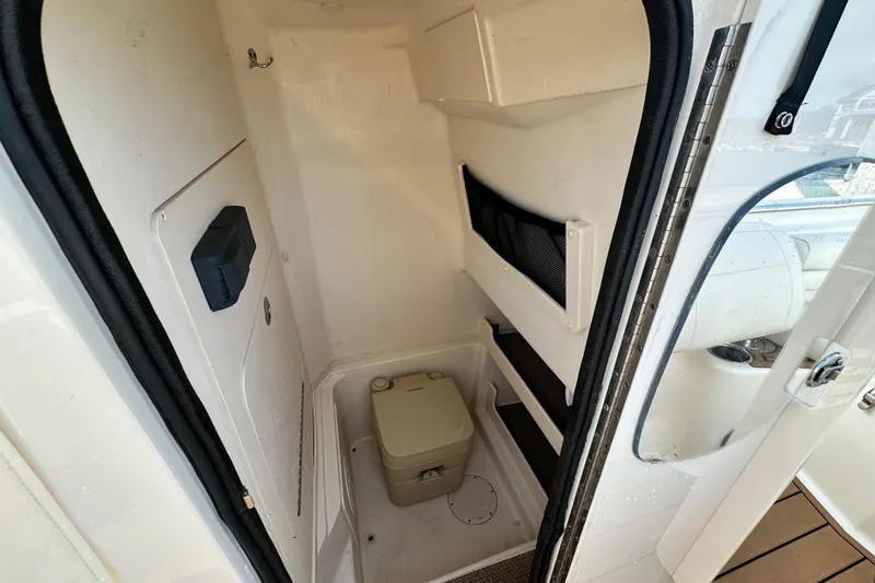 Slide: The Image of 2019 Grady-White Fisherman 257 boat interior with compact marine toilet. - 6