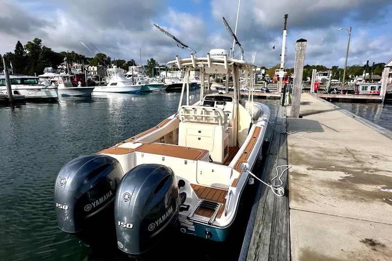 Slide: The Image of 2019 Grady-White Fisherman 257 boat docked with twin Yamaha engines. - 2