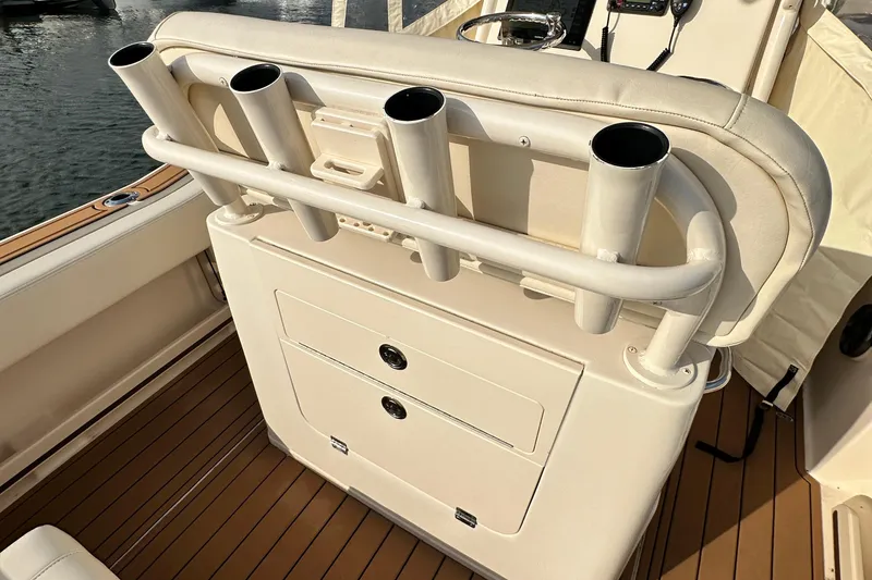 Slide: The Image of 2019 Grady-White Fisherman 257 boat interior with rod holders and storage compartments. - 8
