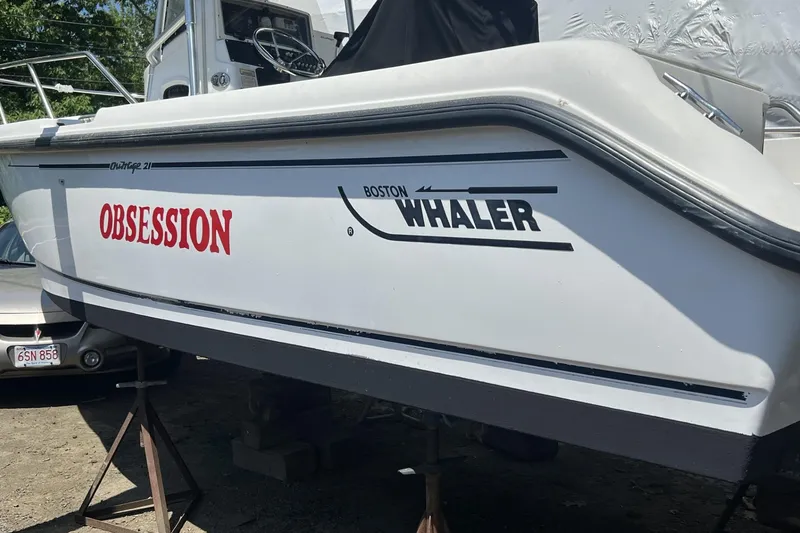 Slide: The Image of 2002 Boston Whaler 21 Outrage boat named "Obsession" on display. - 13