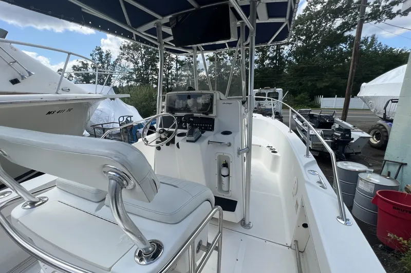 Slide: The Image of 2002 Boston Whaler 21 Outrage boat interior with steering console and seating. - 5