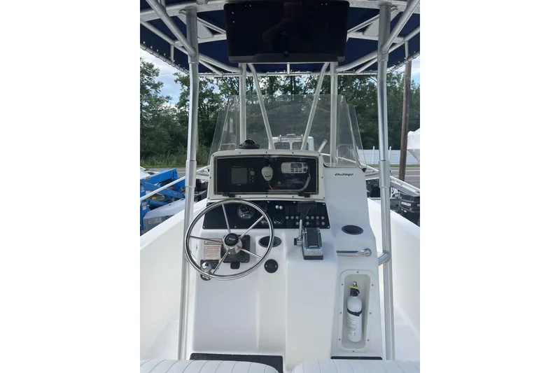 Slide: The Image of 2002 Boston Whaler 21 Outrage boat console with steering wheel and navigation equipment. - 6