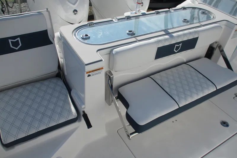 Slide: The Image of 2026 Sea Fox 328 Commander boat seating and storage area with elegant design. - 13