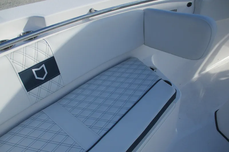 Slide: The Image of 2026 Sea Fox 328 Commander boat interior with white cushioned seating. - 21