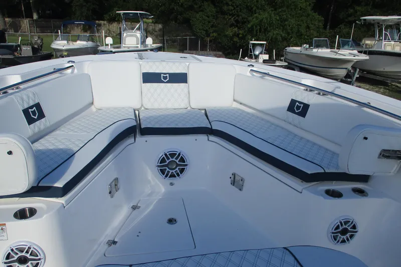 Slide: The Image of 2026 Sea Fox 328 Commander boat interior with cushioned seating and speaker system. - 23