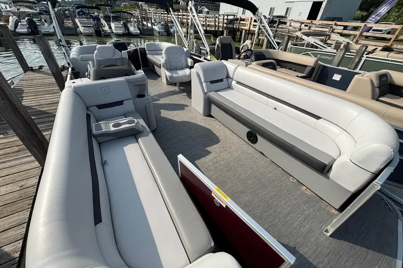 Slide: The Image of 2024 Godfrey Sw2286SB pontoon boat interior with spacious seating and modern design. - 3