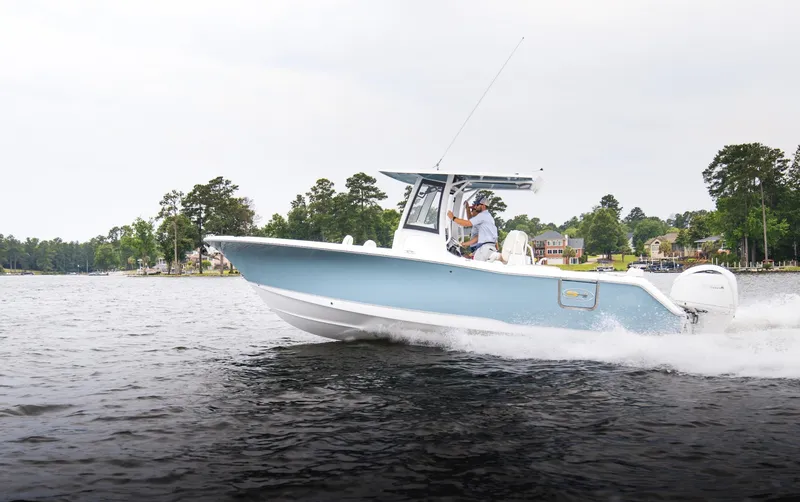 The Image of 2025 Sea Hunt Ultra 275 SE boat cruising on a lake. - 0