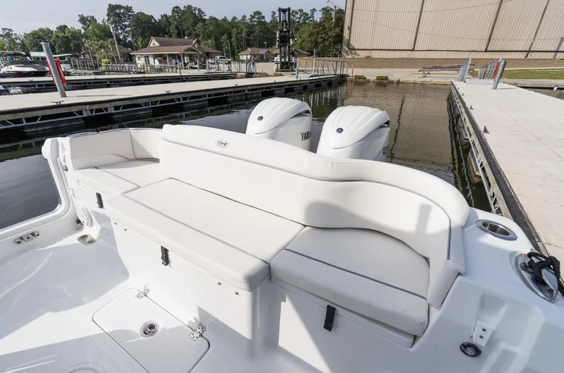 Slide: The Image of 2025 Sea Hunt Ultra 275 SE boat at dock with dual engines. - 11