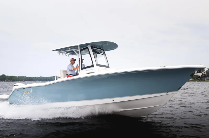 Slide: The Image of 2025 Sea Hunt Ultra 275 SE boat cruising on water. - 3