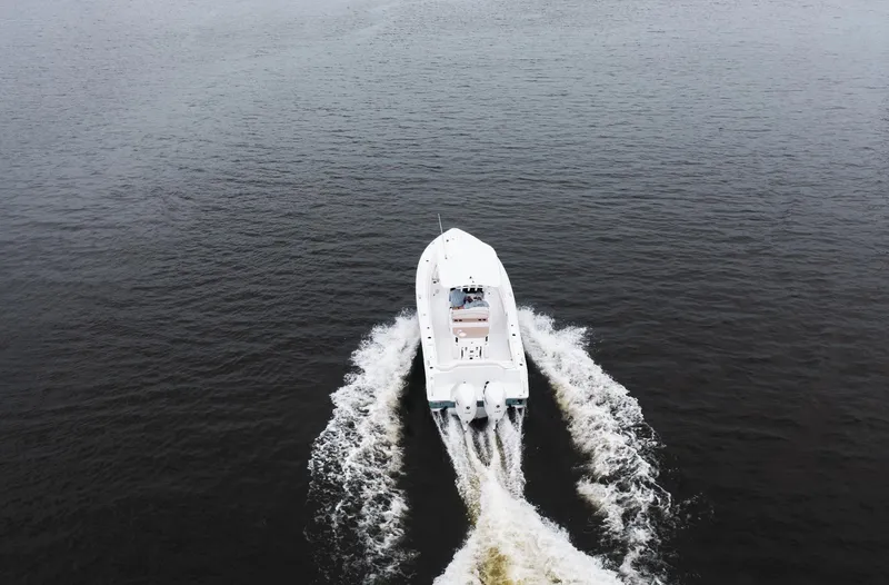 Slide: The Image of 2025 Sea Hunt Ultra 275 SE boat cruising on open water. - 9