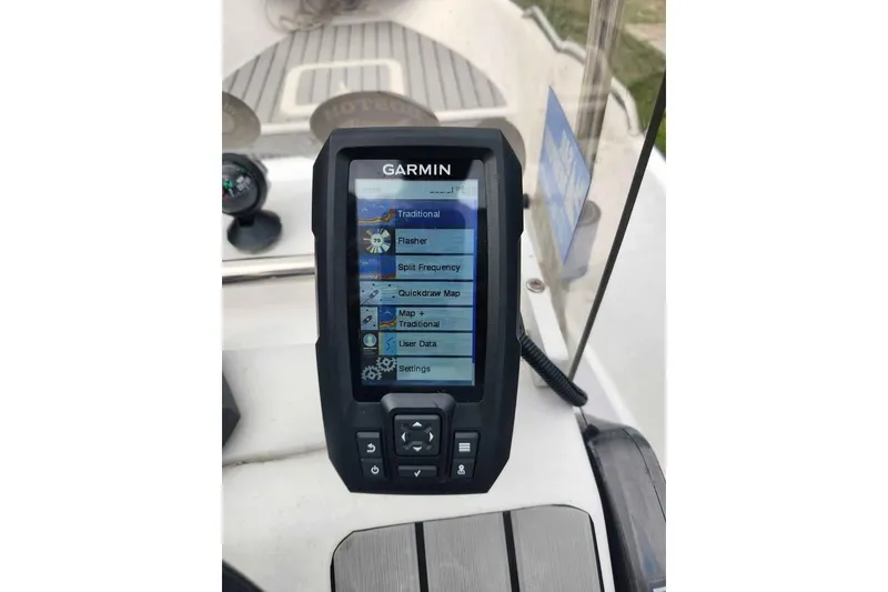 Slide: The Image of Garmin marine GPS device on 2023 ROS Boats model 13 dashboard. - 4
