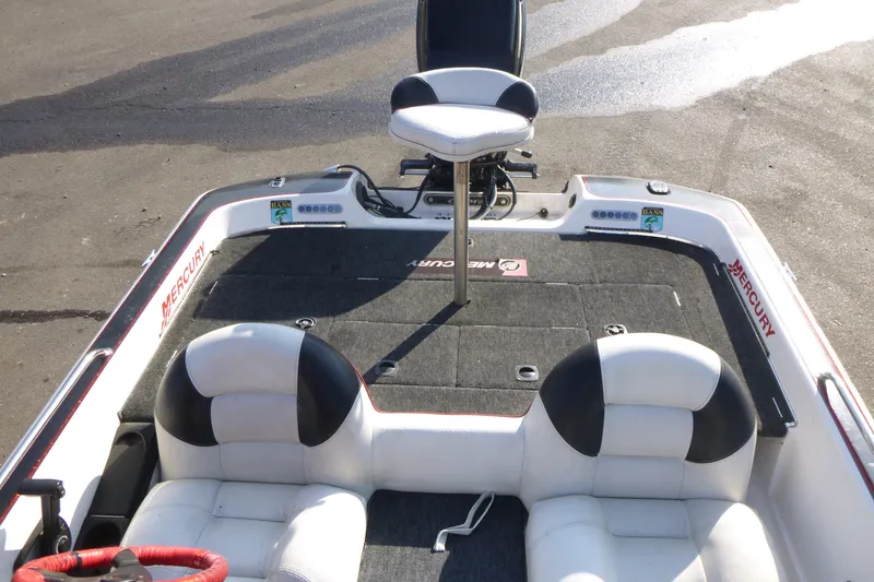 Slide: The Image of 1999 Viper Boats Cobra 201 interior with seating and Mercury branding. - 11