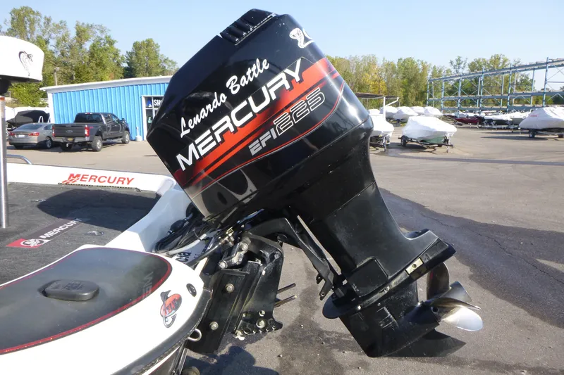 Slide: The Image of 1999 Viper Boats Cobra 201 with Mercury EFI 225 outboard motor in a marina setting. - 12