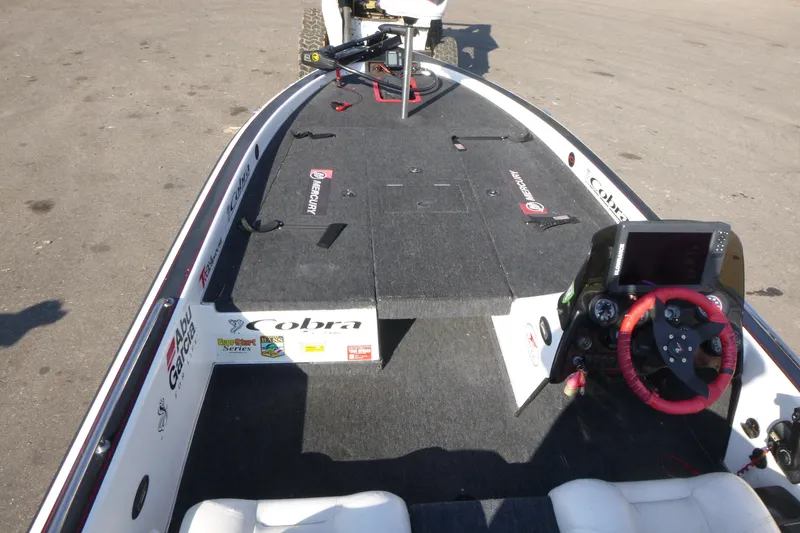 Slide: The Image of 1999 Viper Boats Cobra 201 interior with steering wheel, dashboard, and fishing deck. - 5