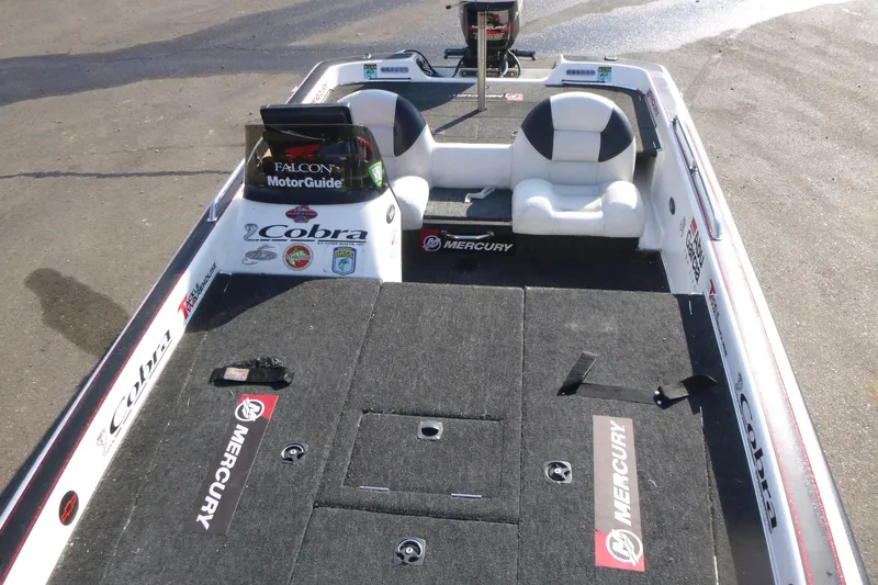 Slide: The Image of 1999 Viper Boats Cobra 201 fishing boat interior with Mercury branding. - 6