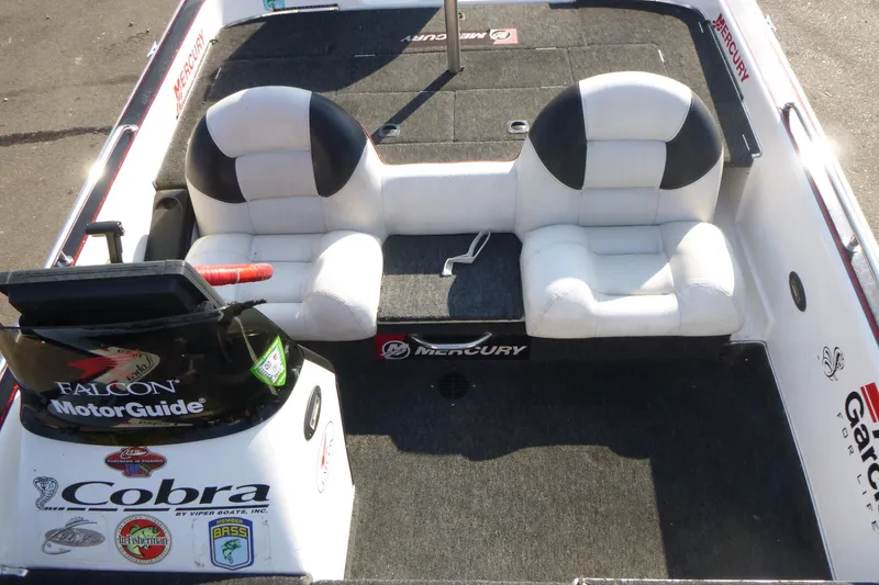 Slide: The Image of 1999 Viper Boats Cobra 201 interior with dual seats and MotorGuide controls. - 8