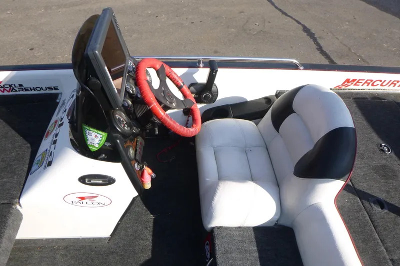 Slide: The Image of 1999 Viper Boats Cobra 201 cockpit with red steering wheel and white seating. - 9