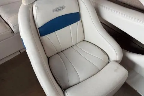 Slide: The Image of 2000 Chaparral 196 SSi boat seat with white and blue upholstery. - 11