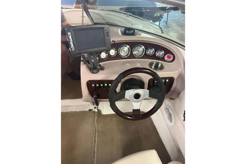Slide: The Image of Steering console of a 2000 Chaparral 196 SSi boat with gauges and Lowrance device. - 18