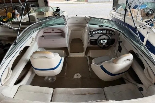 Slide: The Image of Interior view of a 2000 Chaparral 196 SSi boat with seating and dashboard. - 21