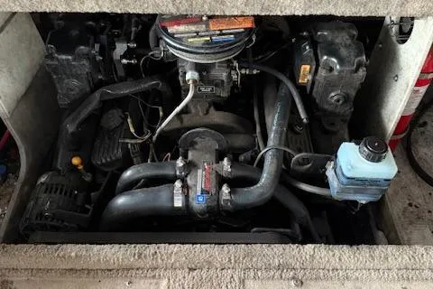 Slide: The Image of Engine compartment of a 2000 Chaparral 196 SSi boat, showcasing mechanical components. - 23