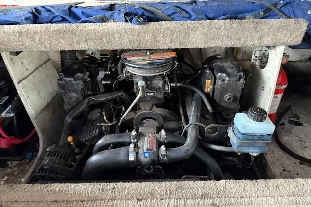 Slide: The Image of Engine compartment of a 2000 Chaparral 196 SSi boat, showing detailed components. - 24