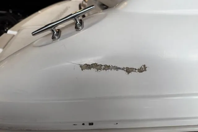 Slide: The Image of Damaged hull of 2000 Chaparral 196 SSi boat with visible crack and wear. - 25